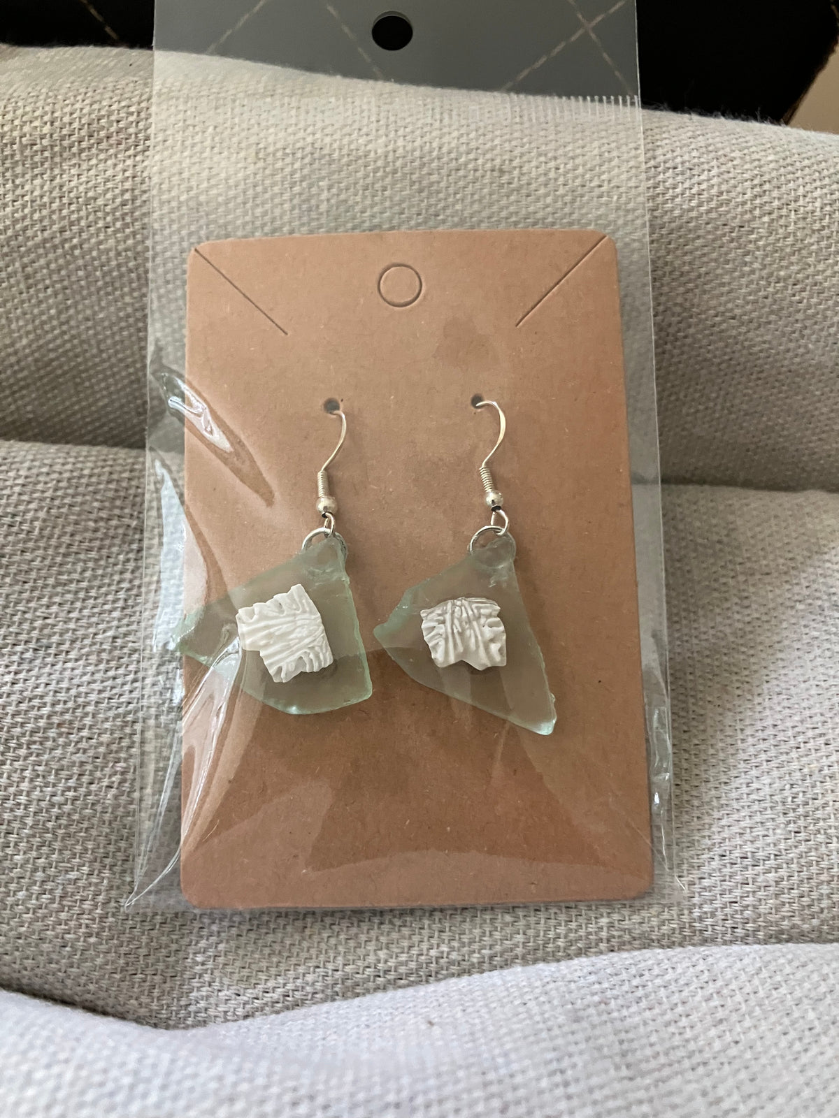 Pale green sea glass and sand dollar piece earrings by Tonya Arnold