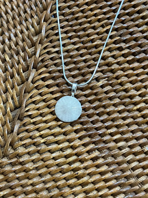 Sand dollar necklace- tiny grey by Tonya Arnold