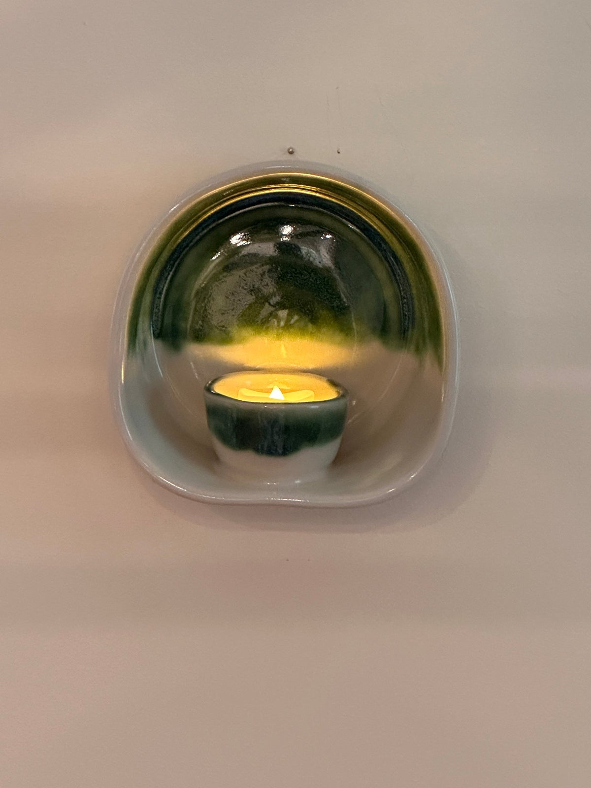 Wall mounted candle sconce