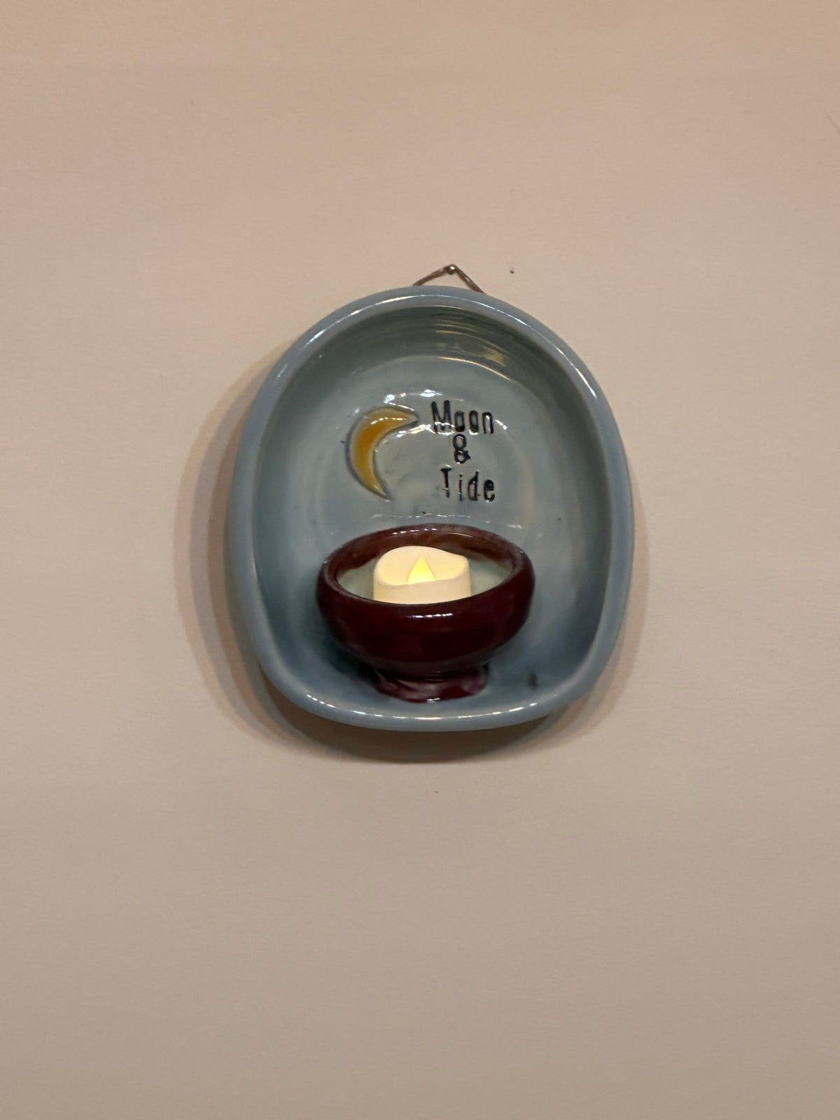 Wall mounted candle sconce