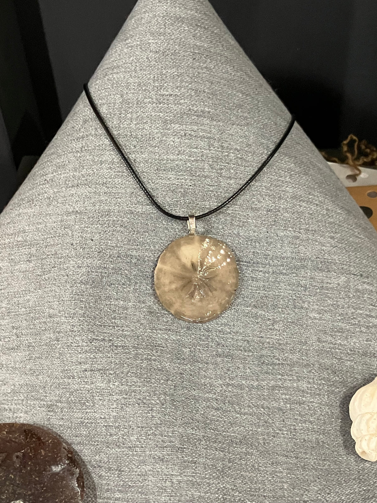 Sand dollar necklace black cord by Tonya Arnold