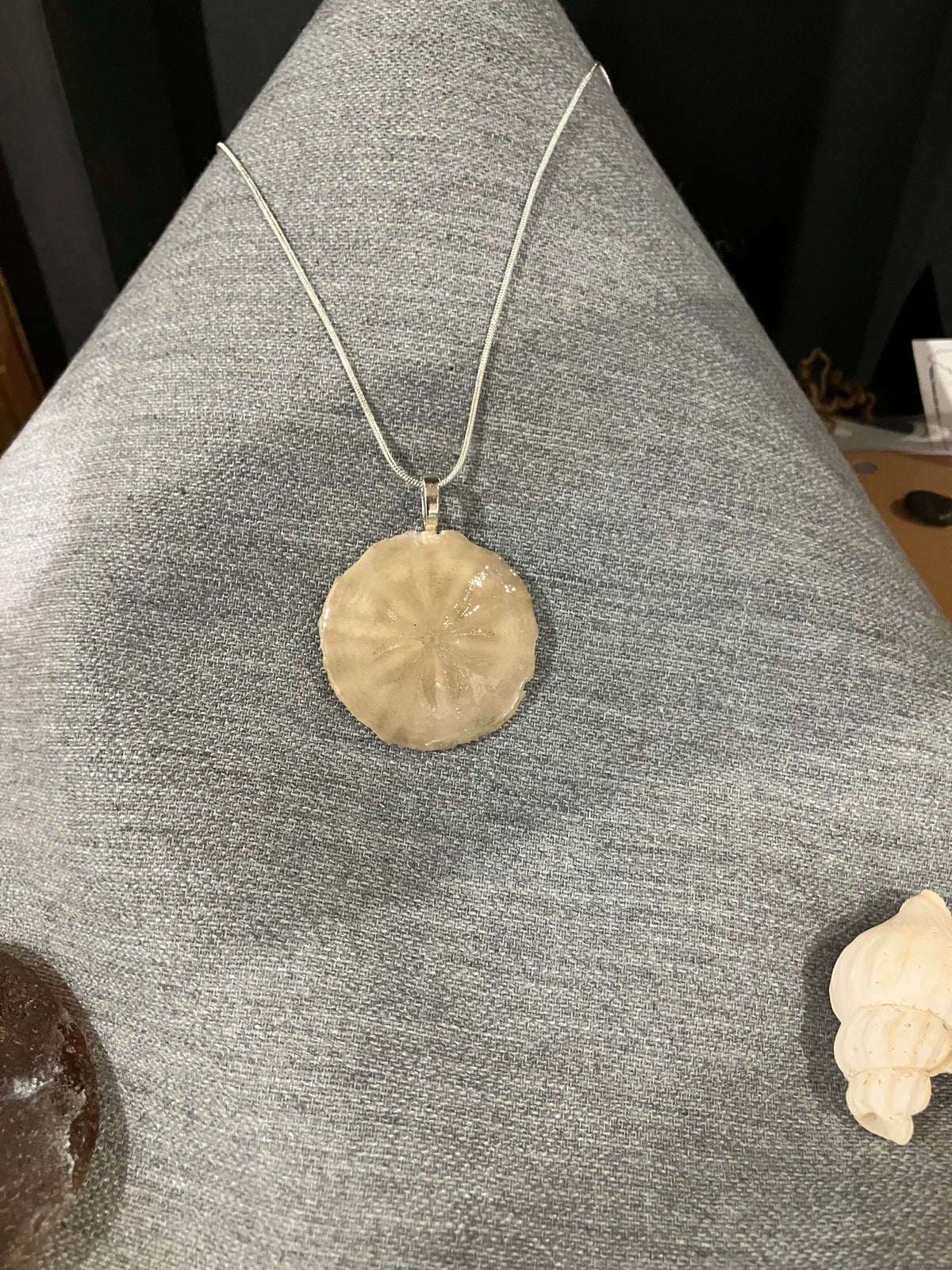 Sand dollar necklace silver cord-cream by Tonya Arnold