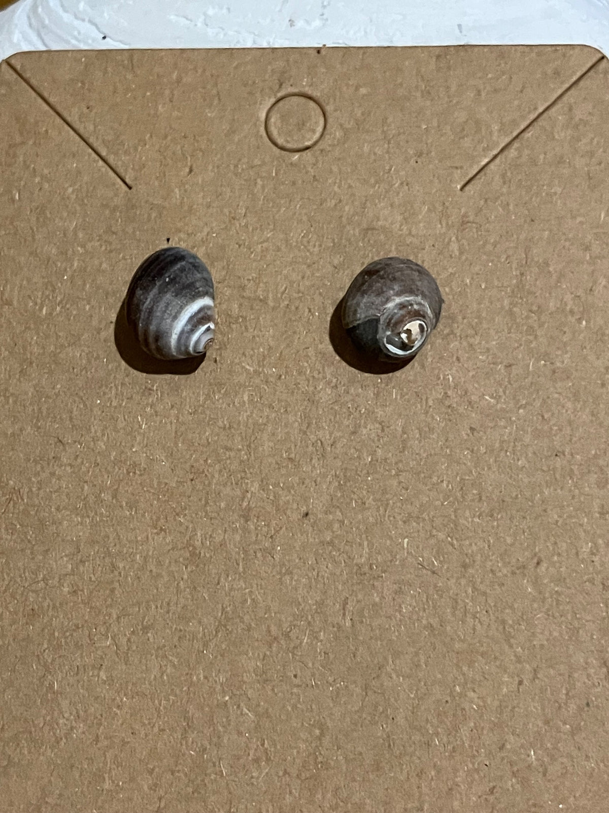 Tiny snail studs by Tonya Arnold