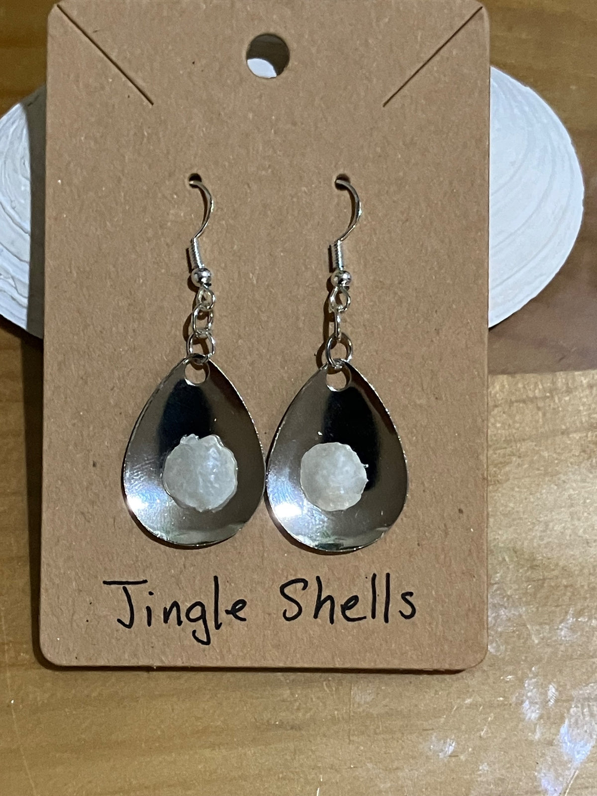 Silver lure jingle shell earrings by Tonya Arnold