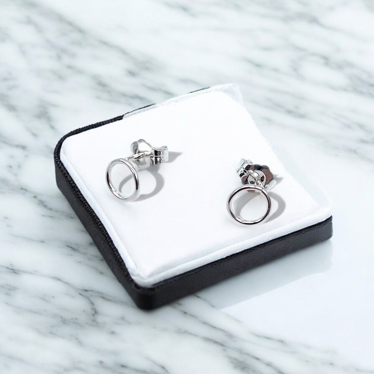 Simple Circle Stud Earrings by Sausalito Precious Metals Inc.